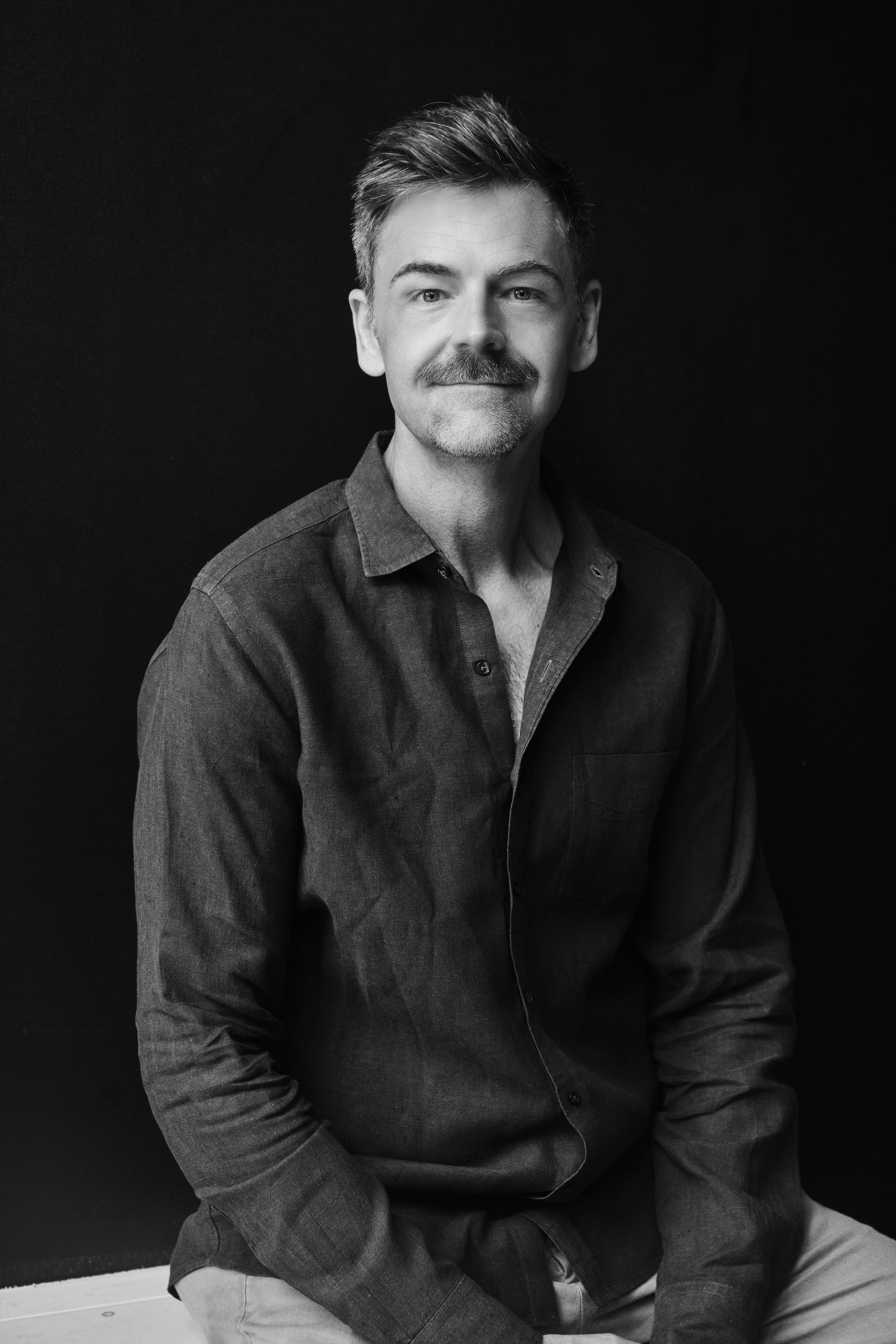 Black-and-white portrait of J.J. Kelley