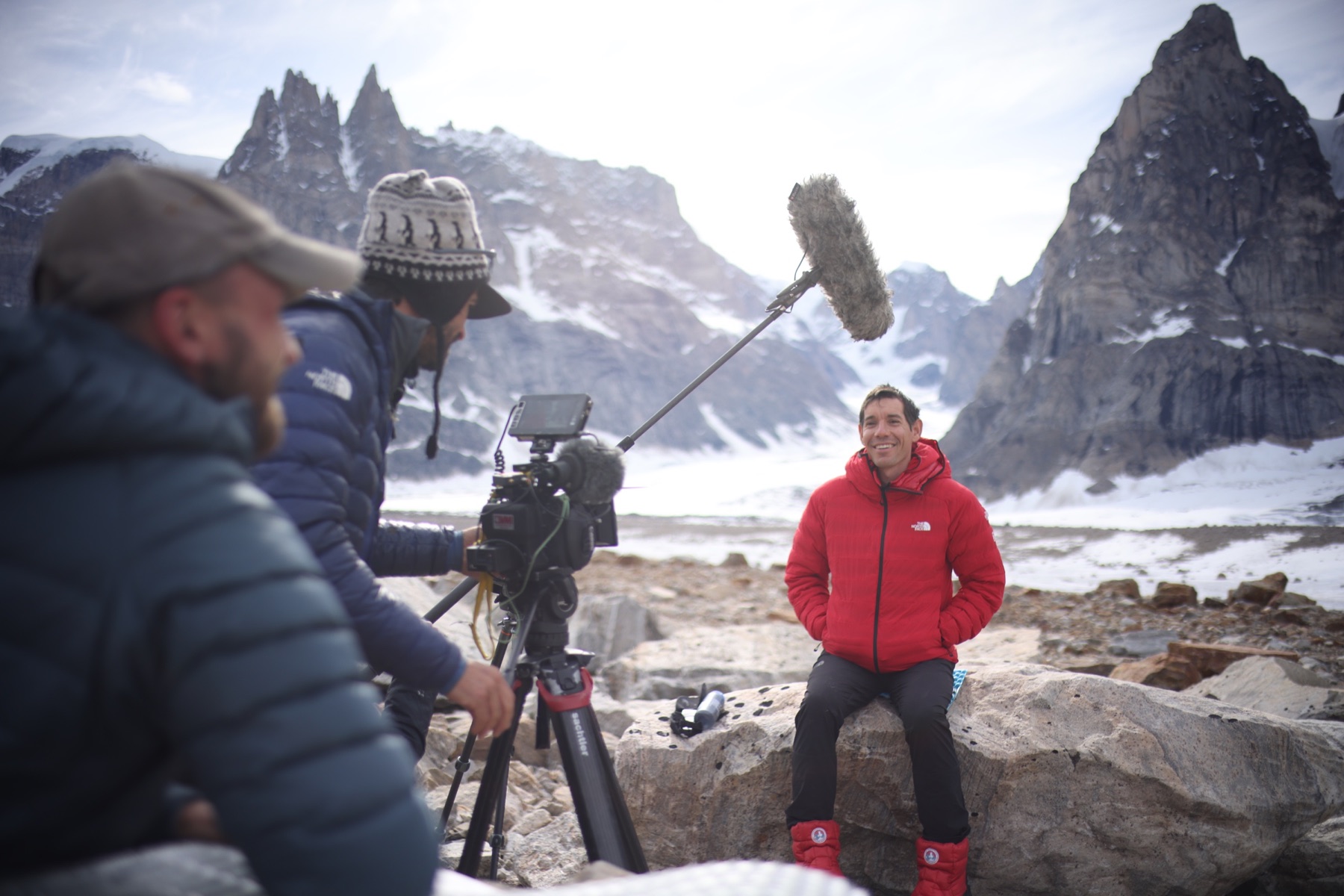 A camera team filming Alex Honnold in Greenland