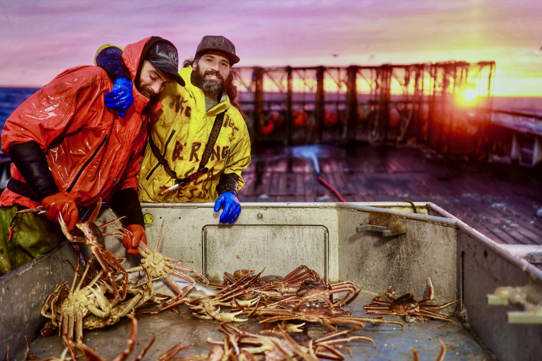 Deckhands sorting crab at sunset