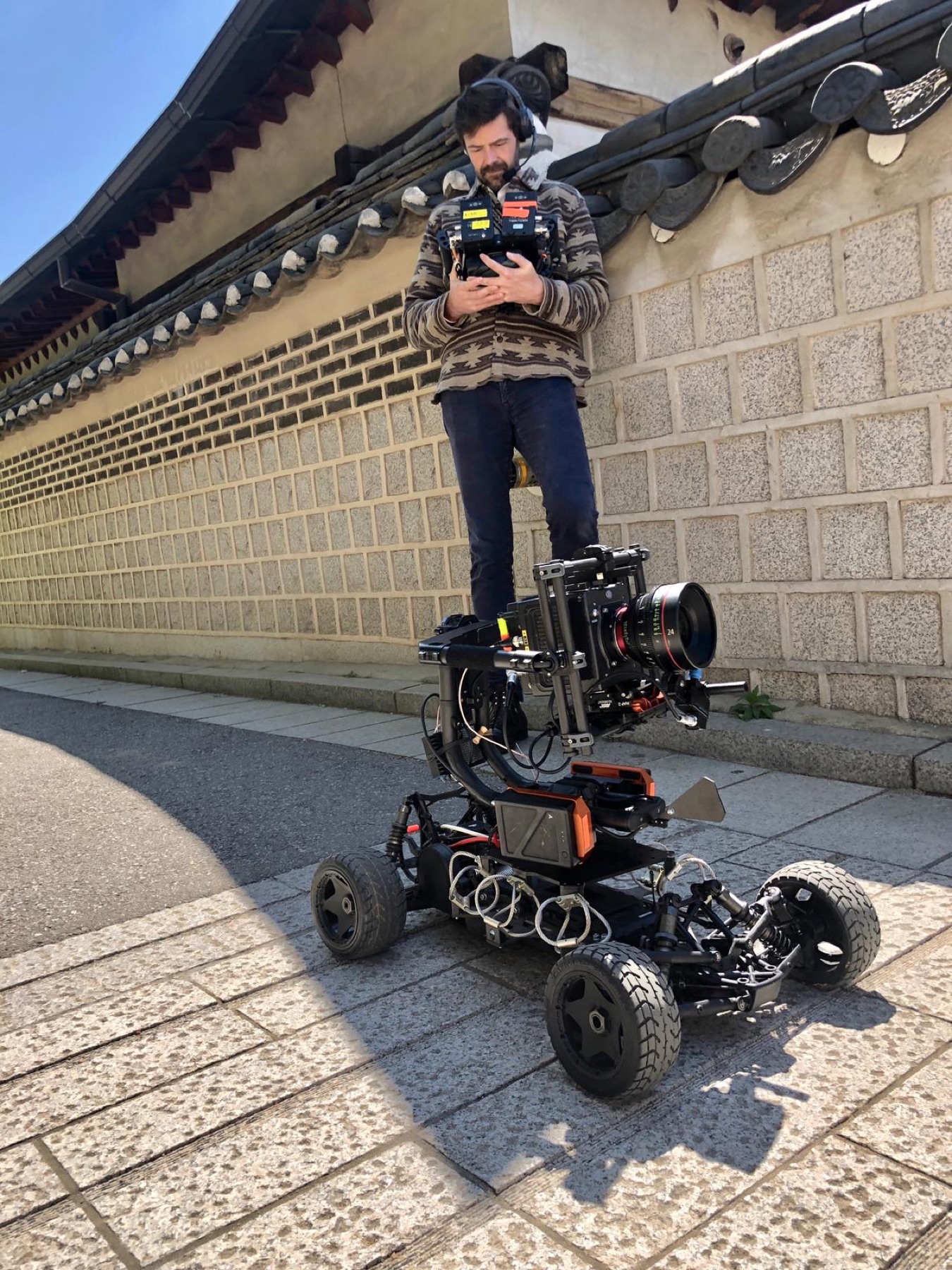 A camera operator working with a remote camera car