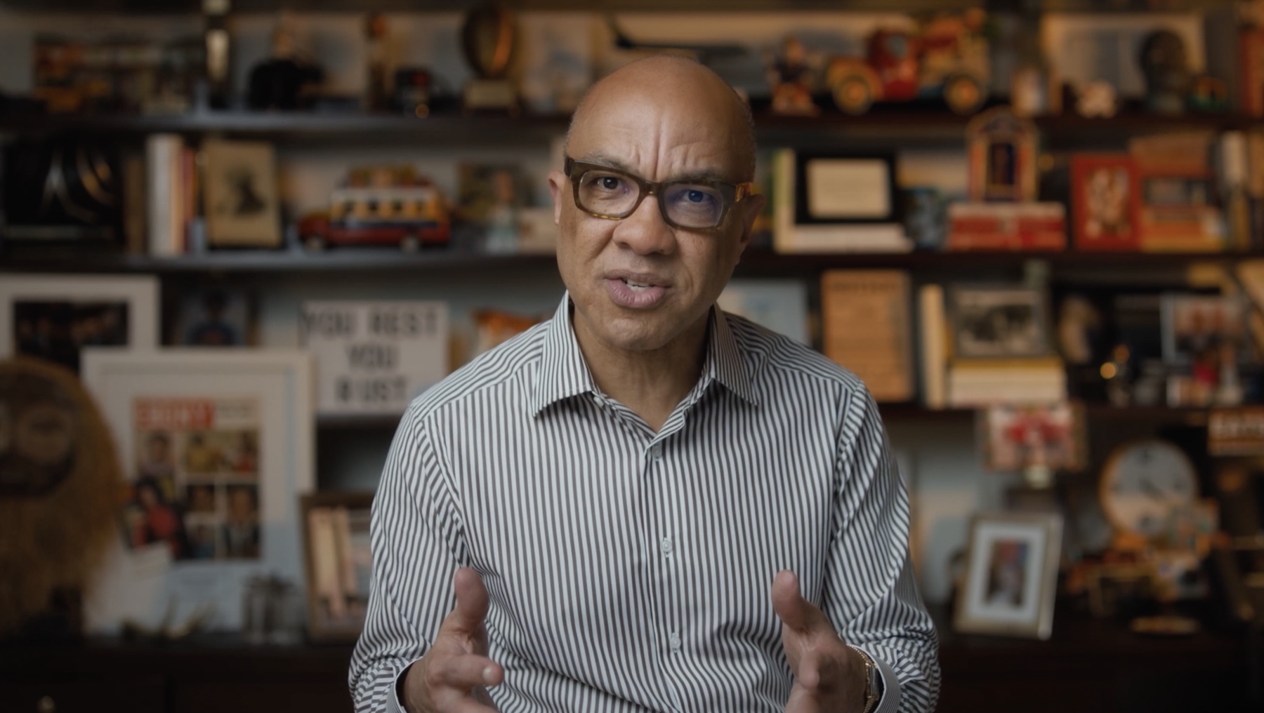 Darren Walker speaking from a personal library