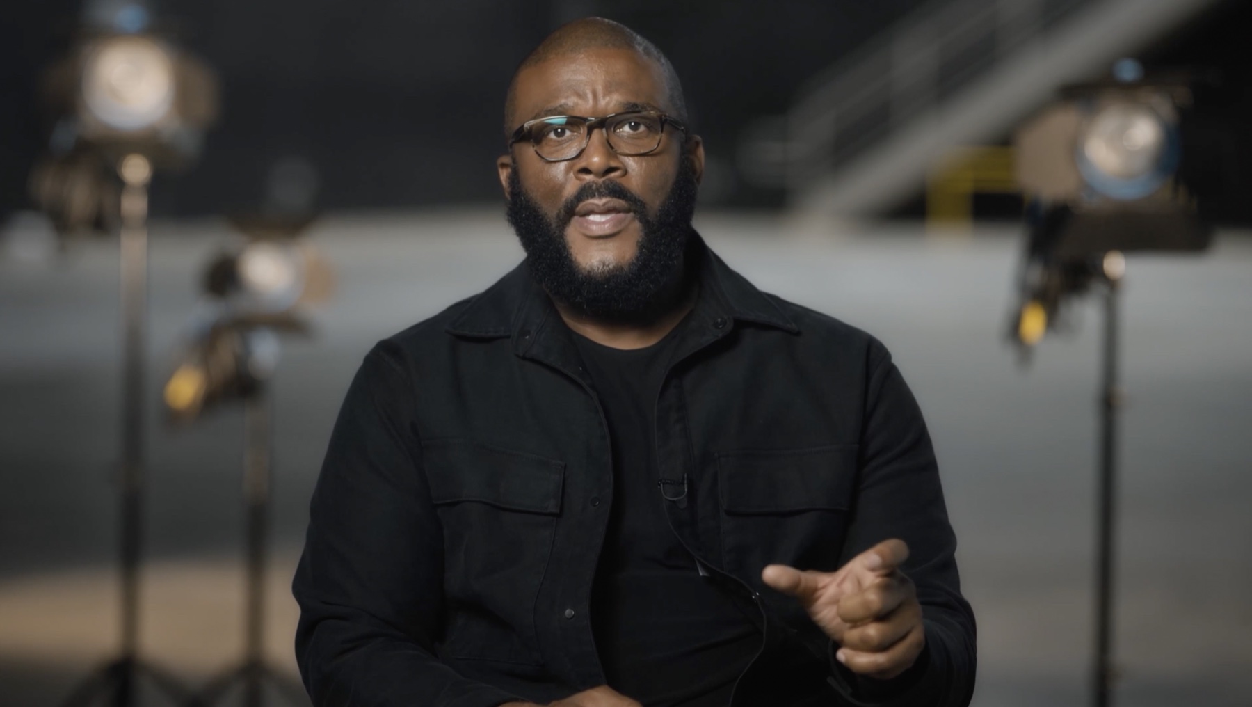 Tyler Perry speaking in a studio